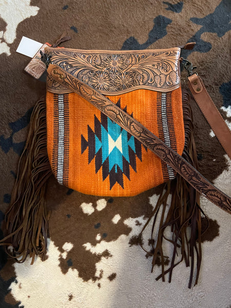 Saddle blanket and tooled leather bags