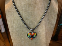 Colorful heart on pearls